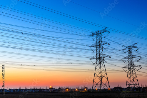 high voltage post,High voltage tower sky sunset background