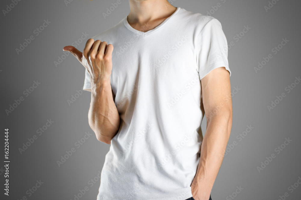 The guy in white t-shirt pointing finger left. Specifies the direction. Isolated The guy in white t-shirt pointing finger left. Specifies the direction. Isolated