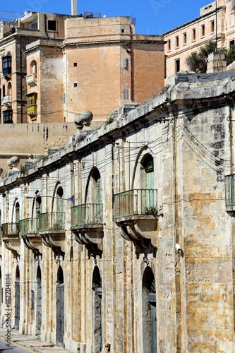 Traditional buildings with balconies near the waterfront  Valletta  Malta.