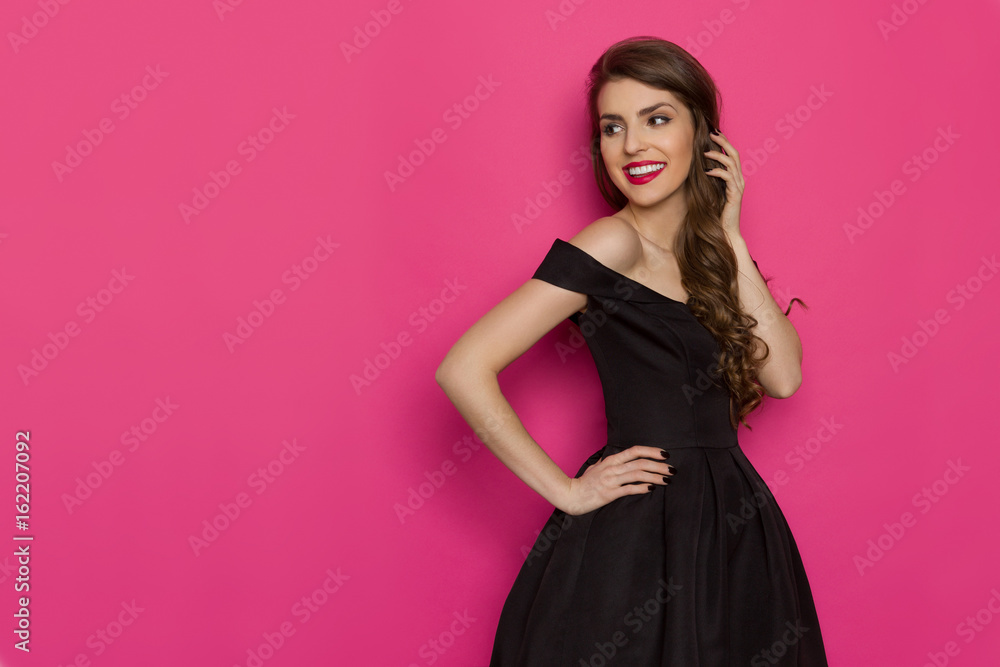 Smiling Elegant Woman In Black Dress Is Looking Away Smiling Elegant Woman In Black Dress Is Looking Away