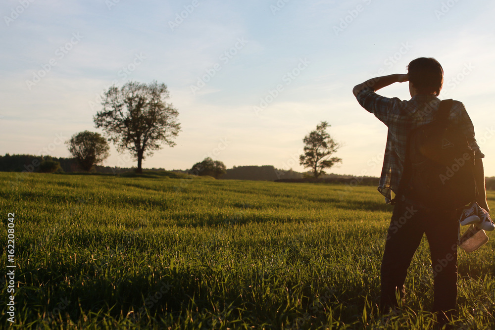 Man in casual clothes is a traveler in the open spaces Man in casual clothes is a traveler in the open spaces
