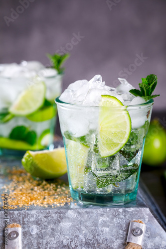 Mojito Cocktail.Mint, lime, ice ingredients for making  and bar utensils.Cold Drink.Top View.Copy space for Text.selective focus.