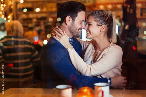 Young attractive couple on date in bar