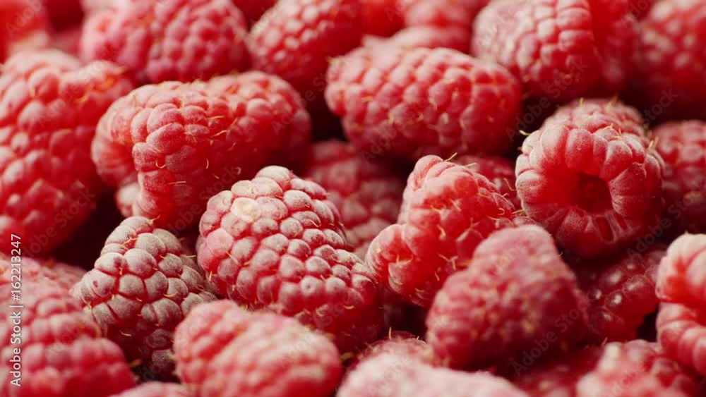 Fruit background. A lot of red raspberries rotate Fruit background. A lot of red raspberries rotate