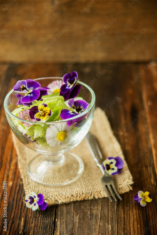 Close up salad leaves garden herbs and edible flowers. Healthy nutrition. Food background Close up salad leaves garden herbs and edible flowers. Healthy nutrition. Food background