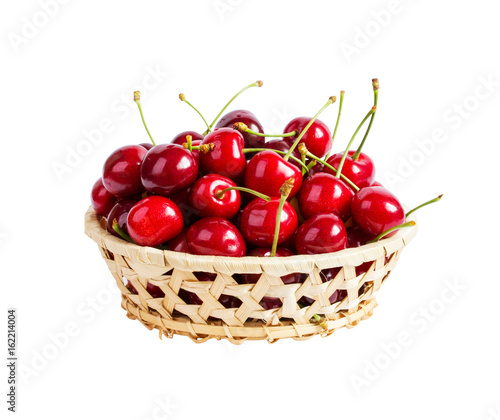 Basket with ripe wet cherry isolated