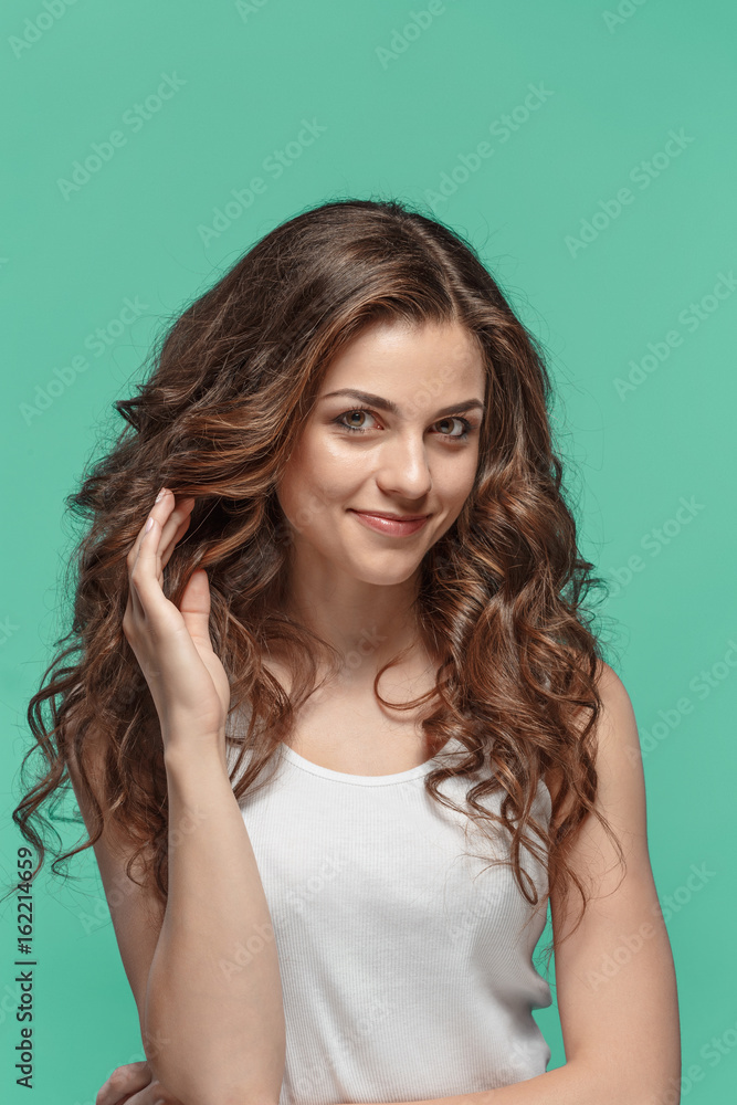 The young woman's portrait with happy emotions The young woman's portrait with happy emotions