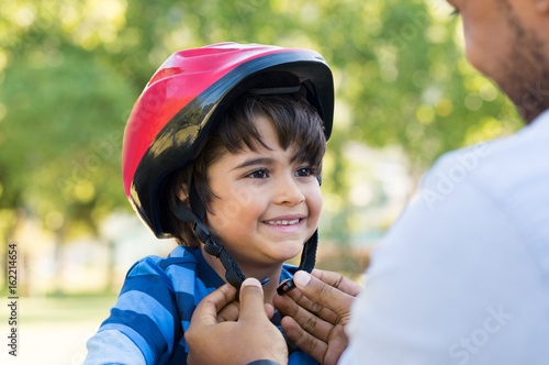 Boy wearing cycle helmet