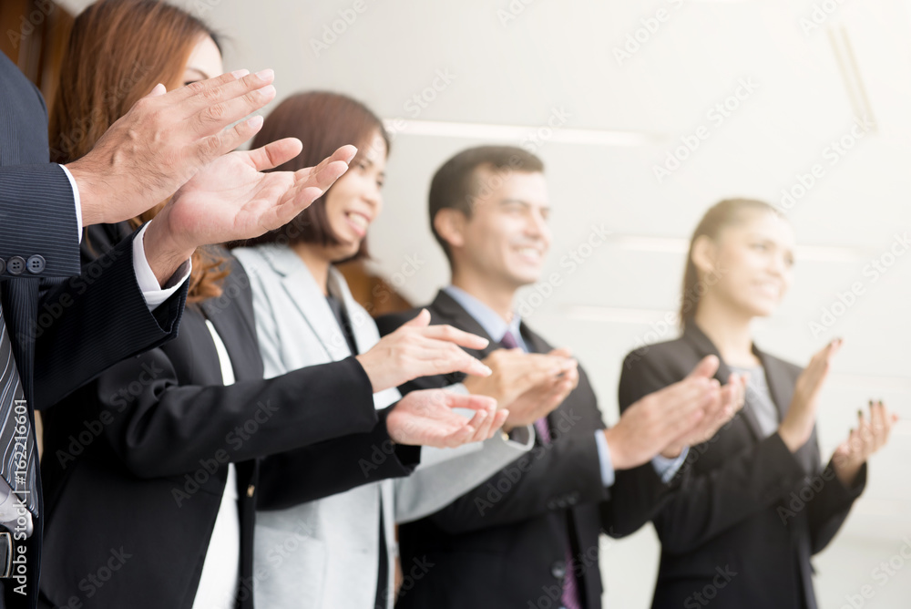 Business people clapping their hands in the meeting Business people clapping their hands in the meeting