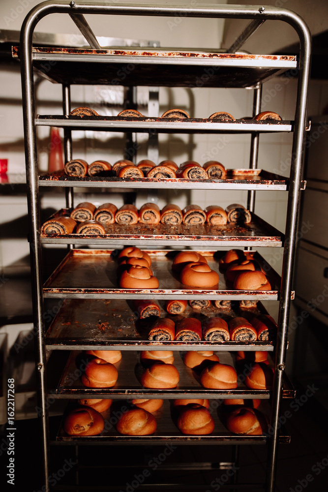 freshly baked rolls on a rack