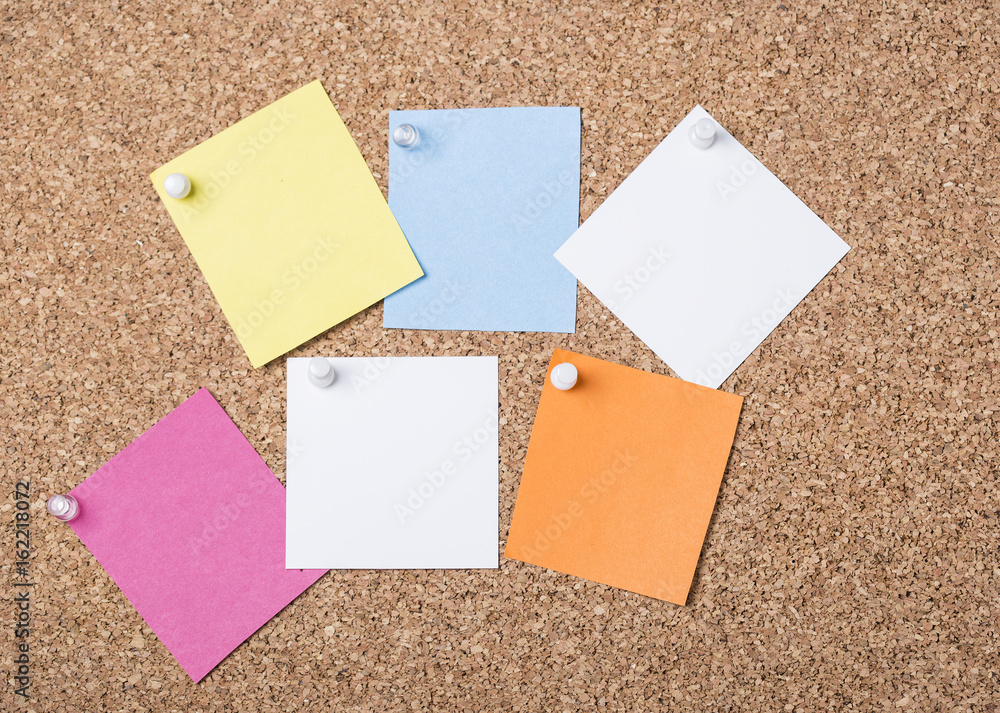 Photo of notes posted to a cork board Photo of notes posted to a cork board