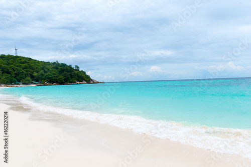 Blue ocean on sandy beach ,Holiday