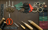 Leathersmith's work desk . Leather working tools on a work table