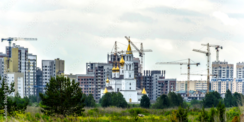 Panorama of construction at the background of the Church .