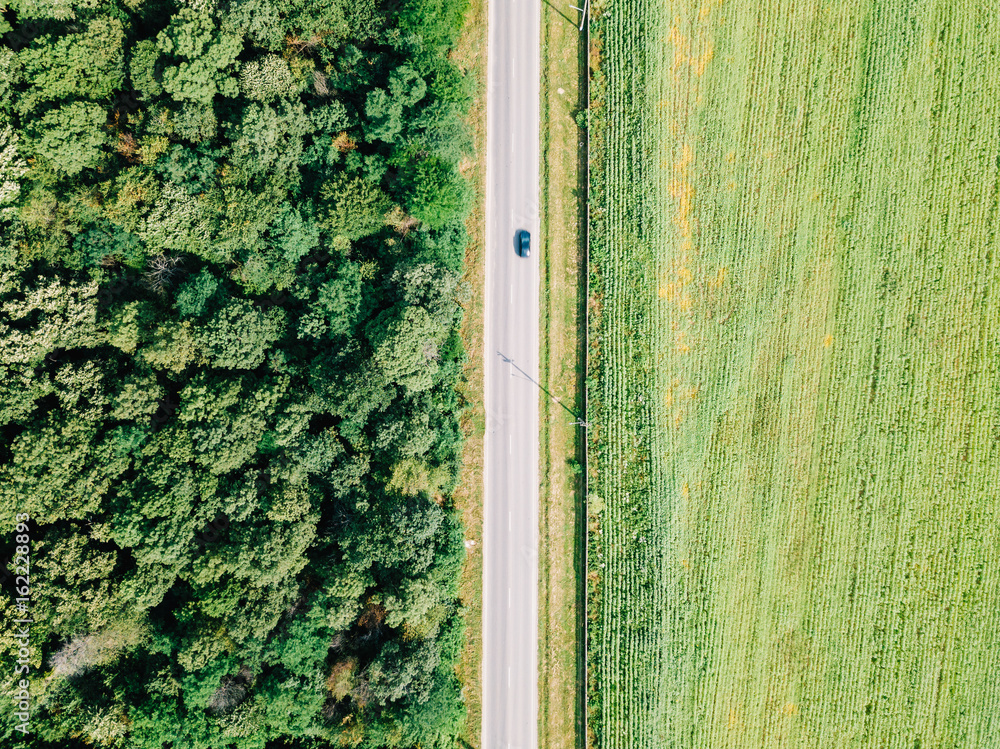 Aerial Drone View Of Moving Cars On Country Road With Forest And Agriculture Crop Field On Sides
