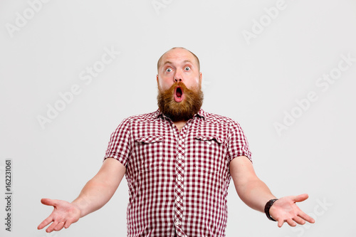 Man with beard waving hands