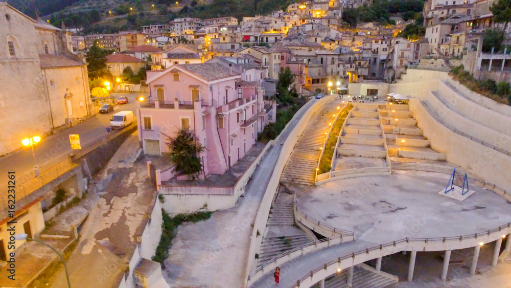 Stilo, Calabria. Aerial view of ancient medieval homes at sunset, Italy