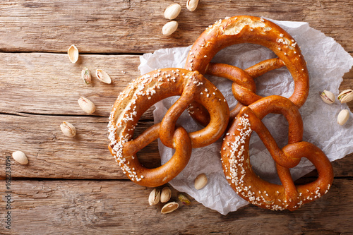 Fototapeta German pretzels with salt close-up on the table
