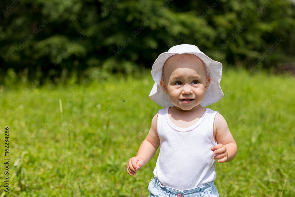 Cute toddler girl running babysteps in nature Cute toddler girl running babysteps in nature