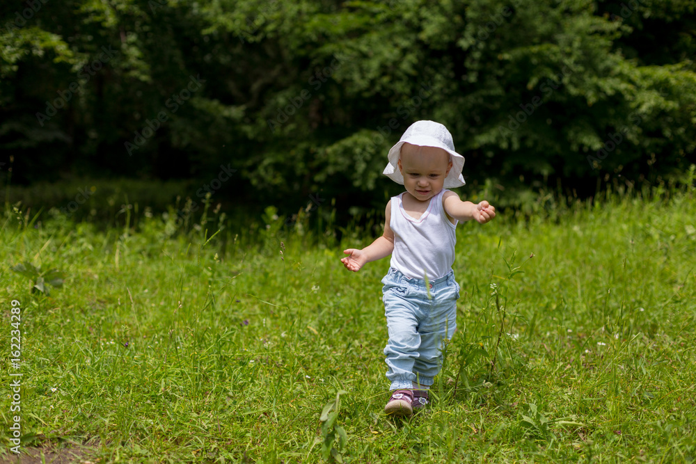 Cute toddler girl running babysteps in nature Cute toddler girl running babysteps in nature