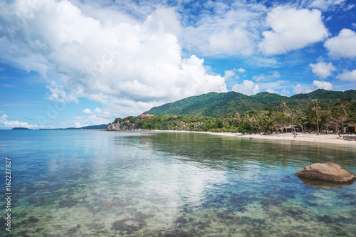Bright tropical landscape, a jungle cloud and the transparent bottom of the sea, the island of Phangan Thailand