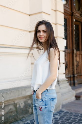 Young beautiful stylish woman walking © Misha
