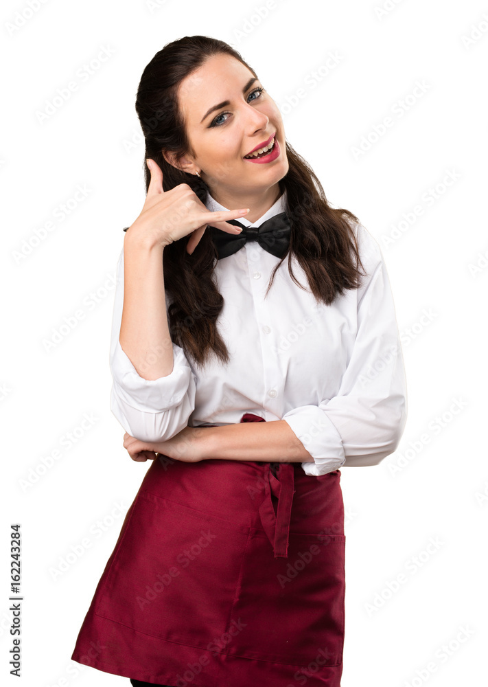 Young beautiful waitress making phone gesture Young beautiful waitress making phone gesture