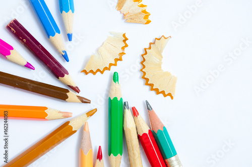 pencils and shavings on white background with copy space, close up