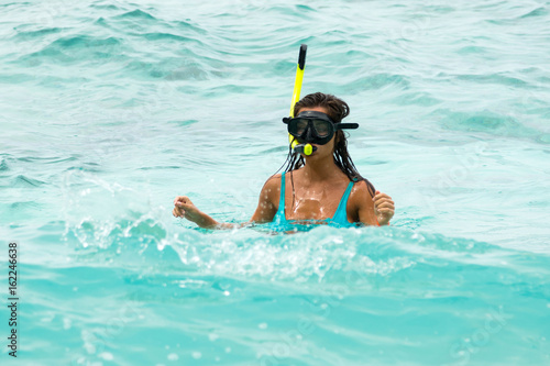 Woman in the sea during snorkeling