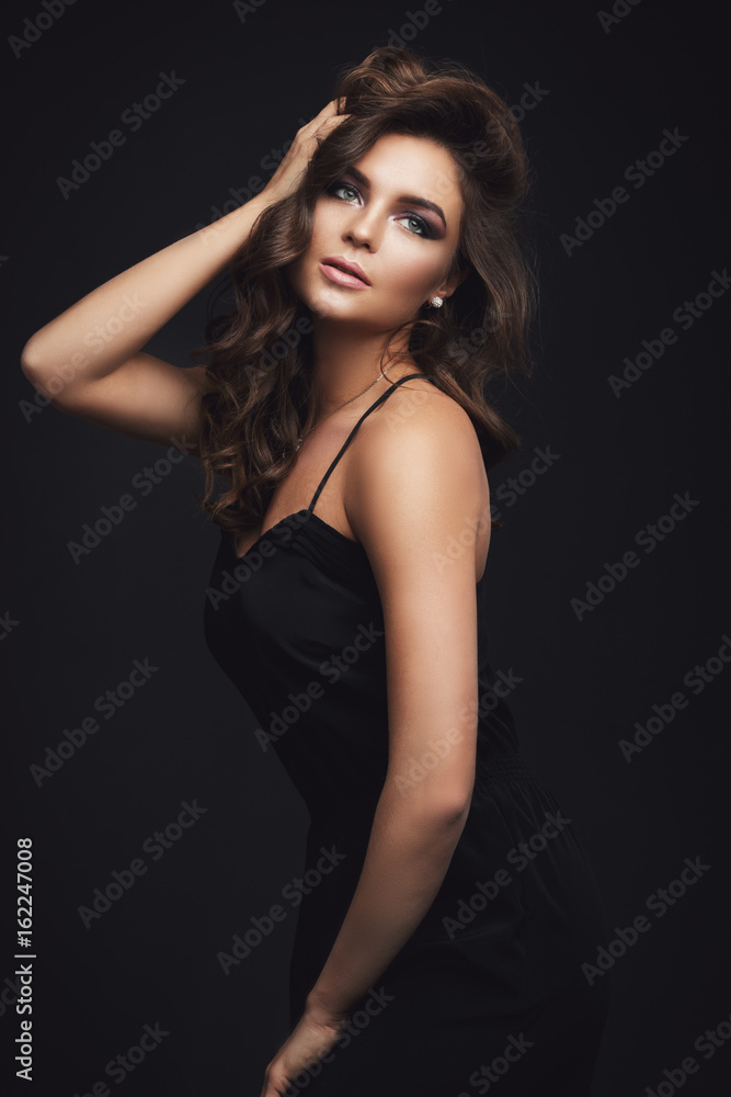 Woman with curly hair and beautiful make-up Woman with curly hair and beautiful make-up