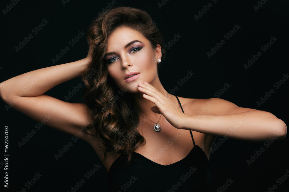 Fototapeta premium Woman with curly hair, beautiful make-up and expensive pendant with a dimond