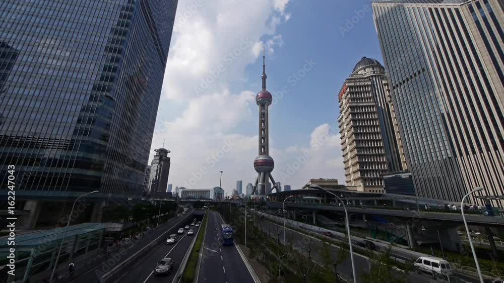 time lapse,shanghai lujiazui business center,skyscraper & orient pearl TV tower,urban traffic.	