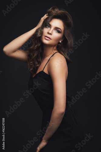 Wallpaper Mural Woman with curly hair and beautiful make-up Torontodigital.ca