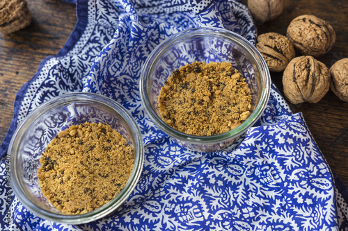 Graham biscuits crumb in a glass jar. Making cheesecake.