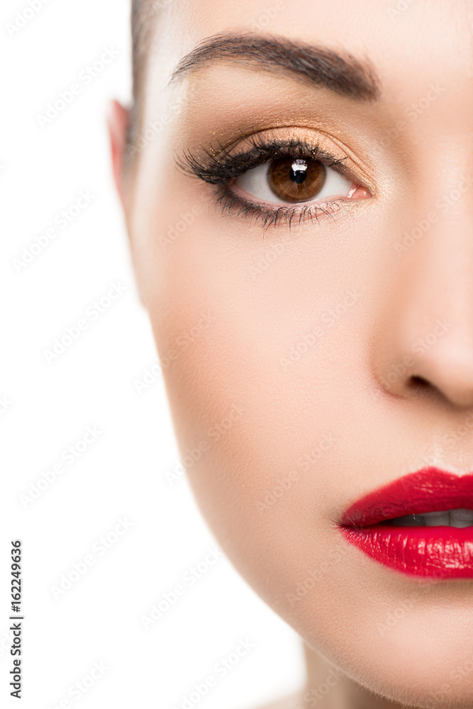 Cropped shot of beautiful young woman with fashionable makeup looking at camera isolated on white Cropped shot of beautiful young woman with fashionable makeup looking at camera isolated on white