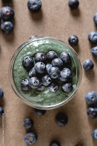 Fresh juicy bluesberries spirulina smoothies in the glass. Simple background. Healthy food. Detox. Lifestyle.