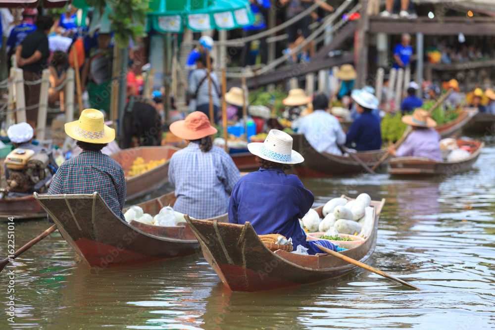 many of sellers making trading food and vegetable in floating market for tourist and people
