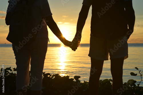 Senior couple standing on seashore