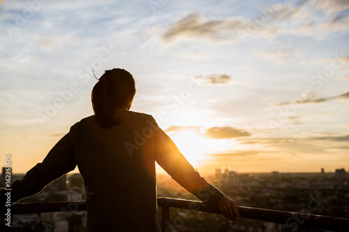 women see city view when sunset time