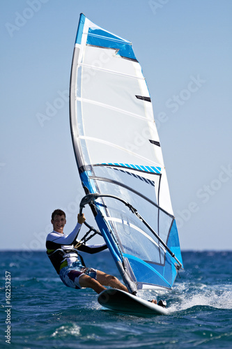Young man surfing the wind