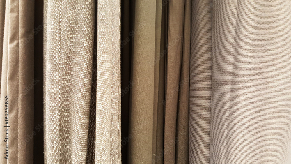 Fototapeta premium group of grey fabric roll selection / stock of grey fabric for fashion design business, raw material in garment manufacturing