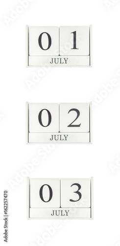 Closeup group of white wooden calendar with black 1 july , 2 july , 3 july word , three date calendar isolated on white background