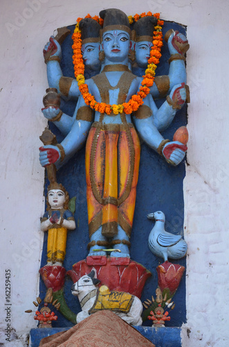 Vishnu Blue Statue of a Hindu Deity in Varanasi, India photo