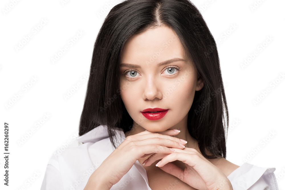 portrait of woman posing with hands on chin and looking at camera looking at camera isolated on white portrait of woman posing with hands on chin and looking at camera looking at camera isolated on white