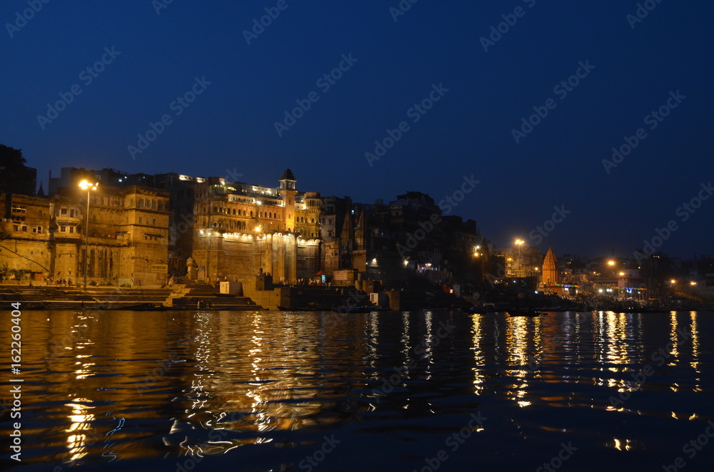 Fototapeta premium Night Light Reflections in The Ganges River in Varanasi, India