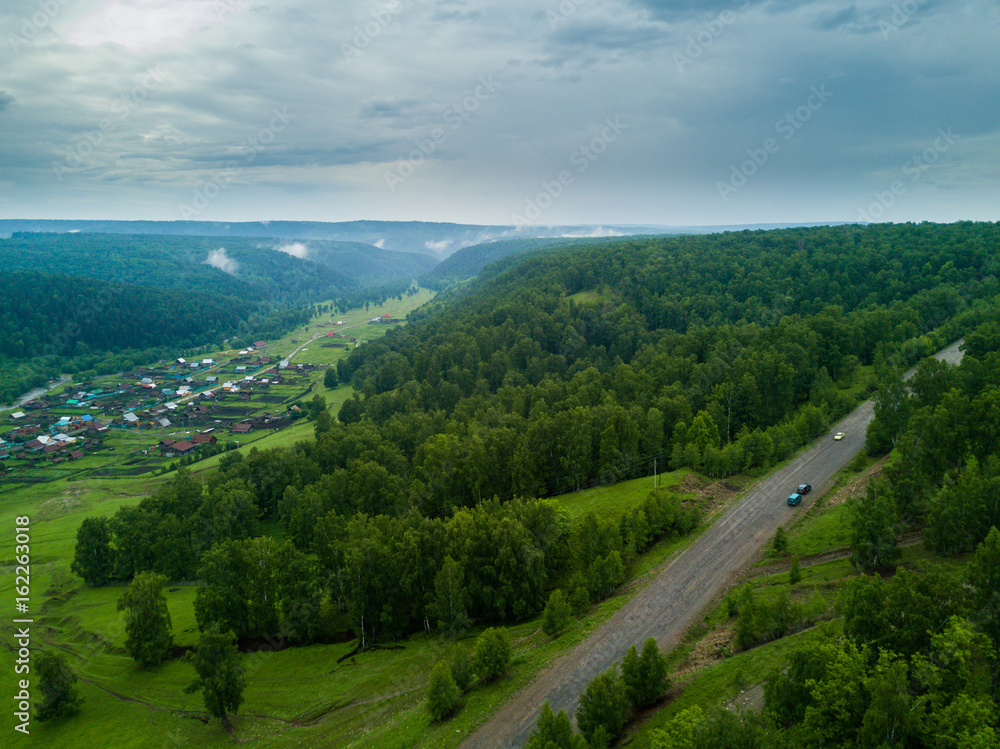 Fototapeta premium Aerial view of the Russian countryside in rainy weather