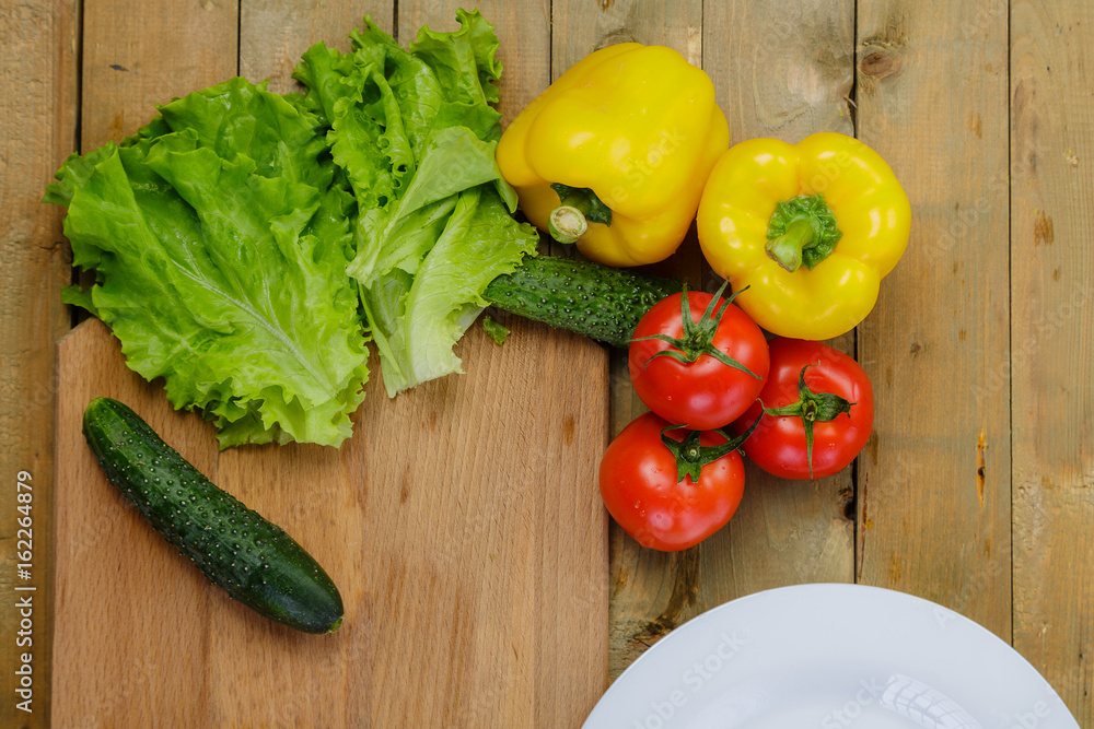 Vegetable salad with tomatoes, yellow pepper, cucumbers Vegetable salad with tomatoes, yellow pepper, cucumbers