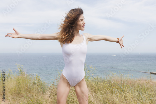 Sexy young girl on the sea background