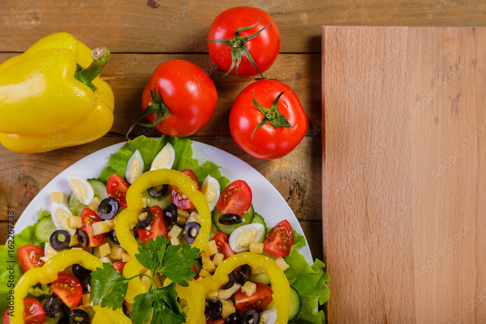 Vegetable salad with tomatoes, olives, yellow pepper, Pekinese cabbage Vegetable salad with tomatoes, olives, yellow pepper, Pekinese cabbage