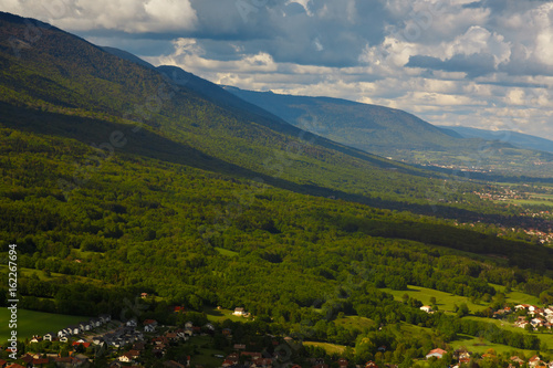 Landscape mountains  village houses. A view of the earth from the sky. Shooting with copter. France. Nature in summer